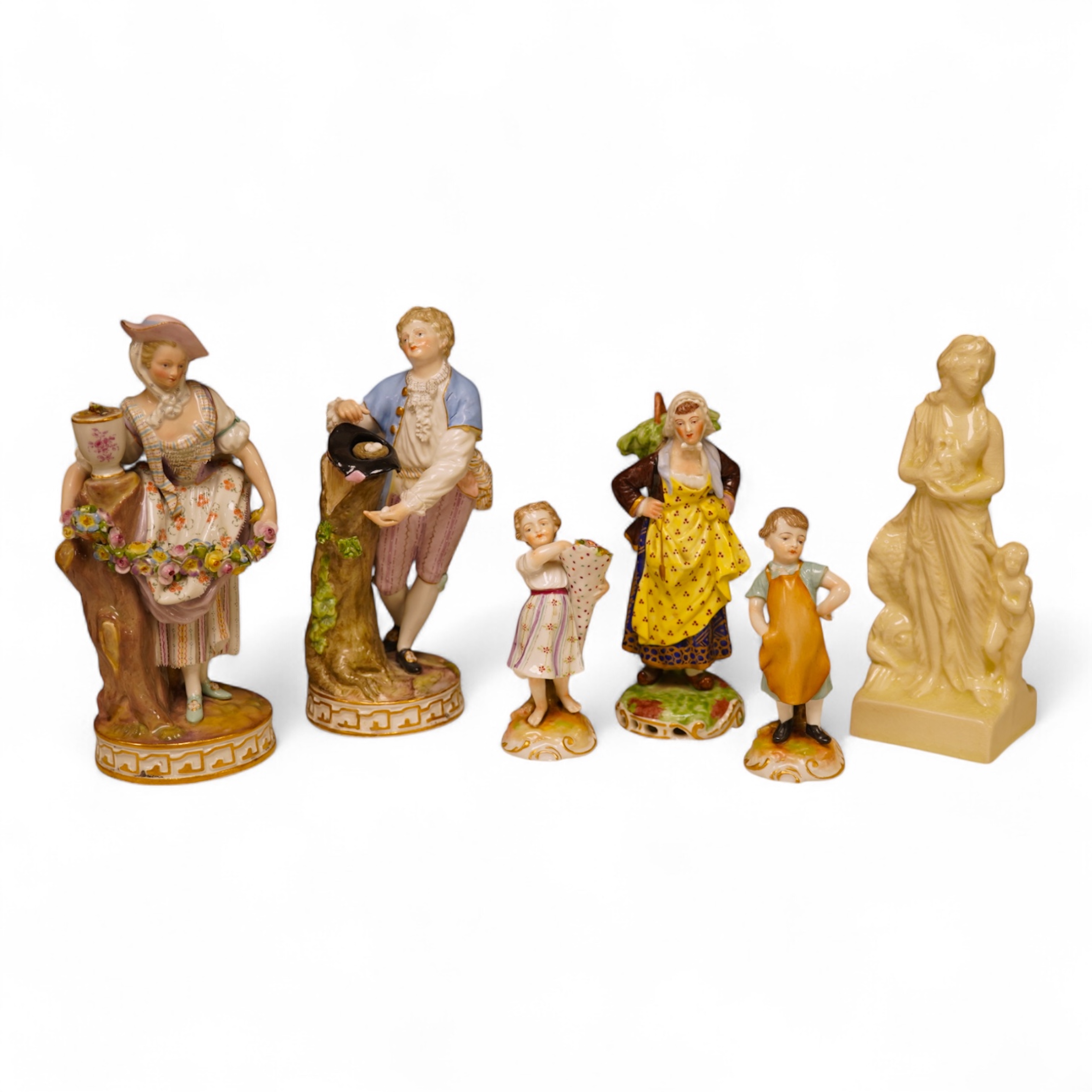 A pair of 19th century Meissen figurines, a Crown Derby figure, a pair of miniature figures and a Leeds type creamware group of Venus and Cupid, tallest 18cm high.